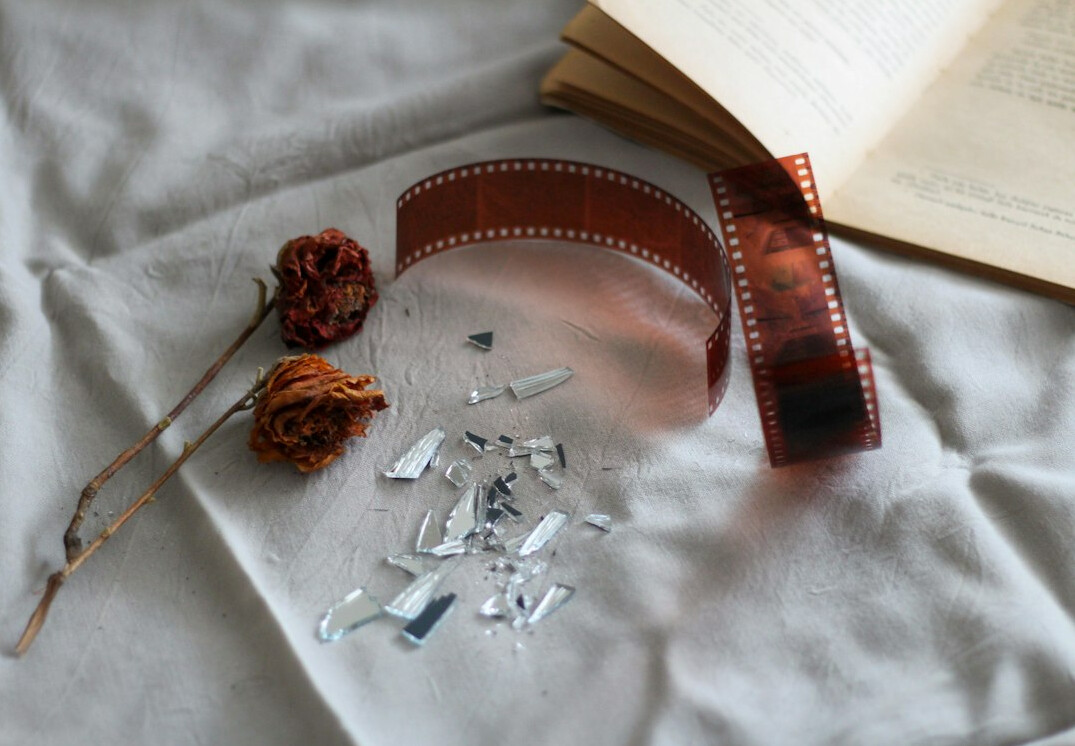 Vintage film reels and film strips on a table